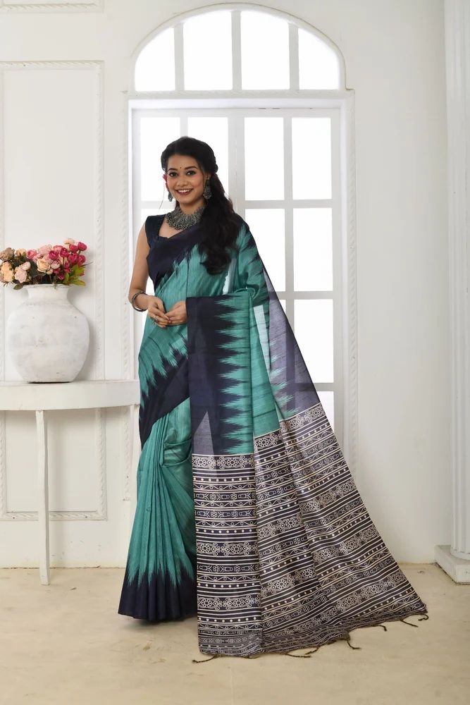 TUSSAR SILK SAREE WITH PRINTED TEMPLE BORDER AND CLASSIC FEBRIC PETTURN.